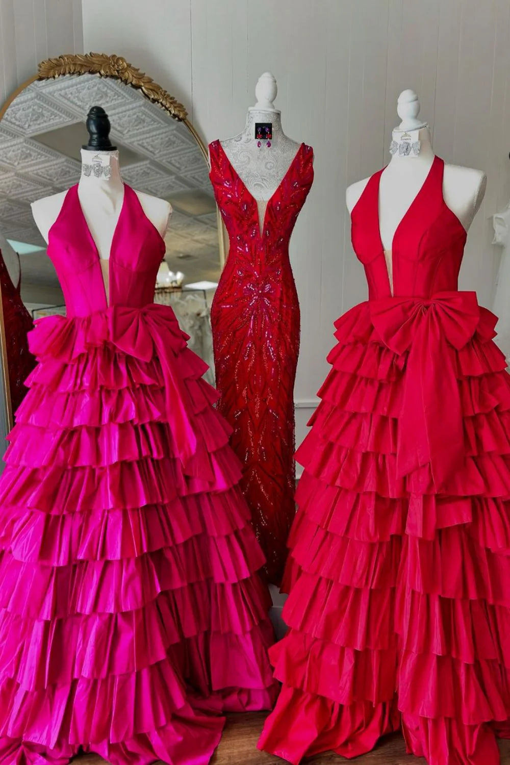 Back view of A-Line halter neck satin prom dress with tiered skirt.