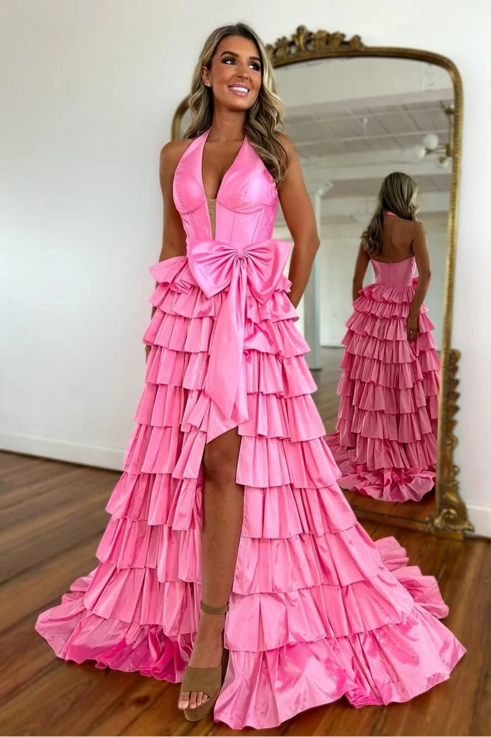 Side view of A-Line halter neck satin prom dress, showing tiered skirt.