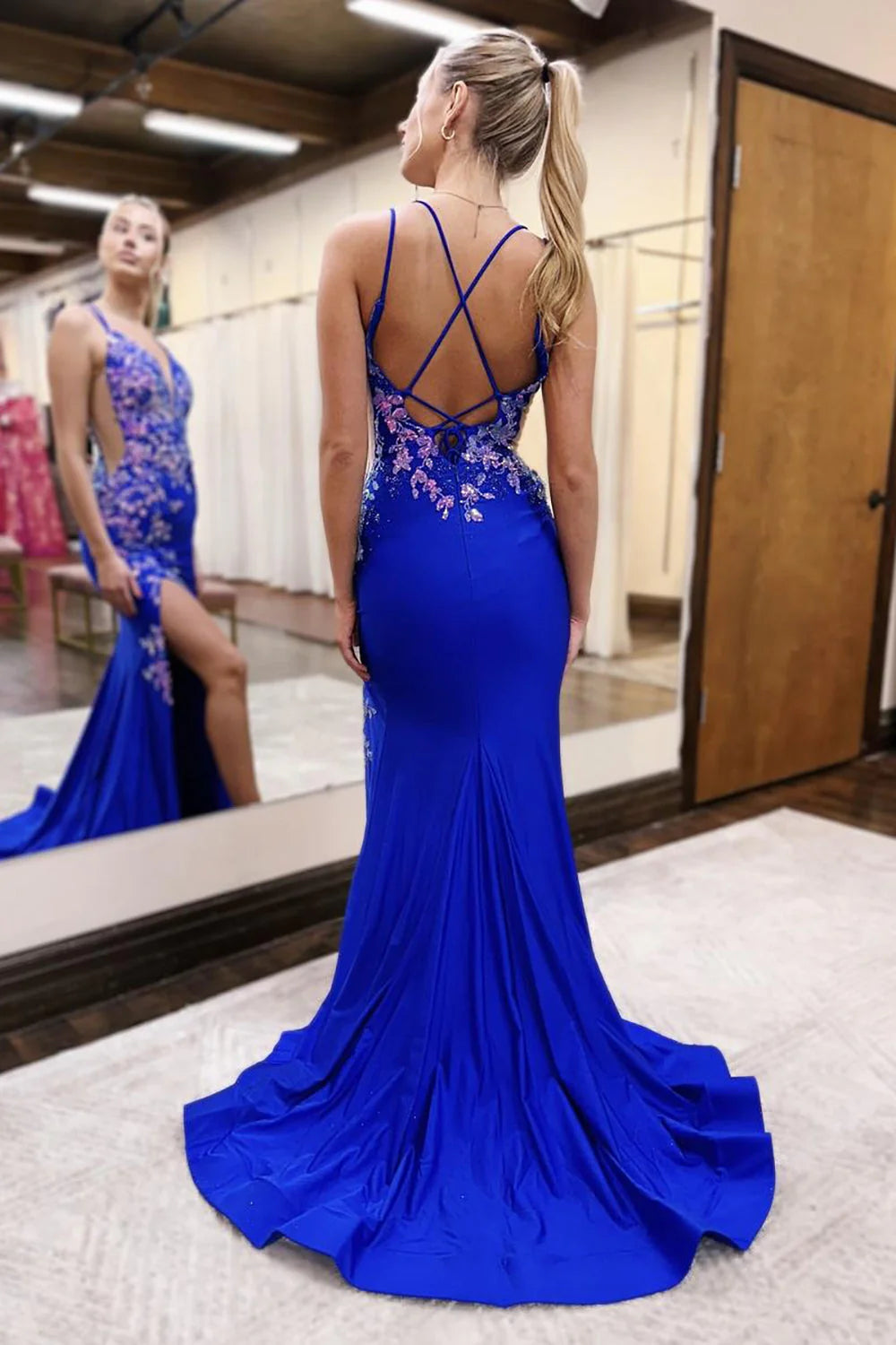 Back view of the royal blue mermaid prom dress, highlighting the elegant lace-up detail.
