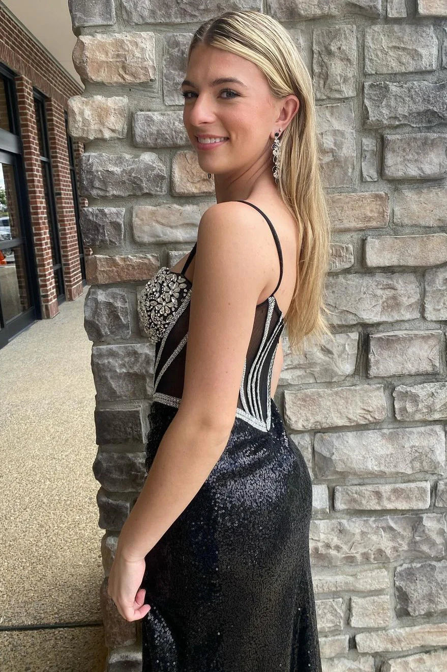 Side view of a black mermaid prom dress, showcasing the sequin fabric and elegant high slit.