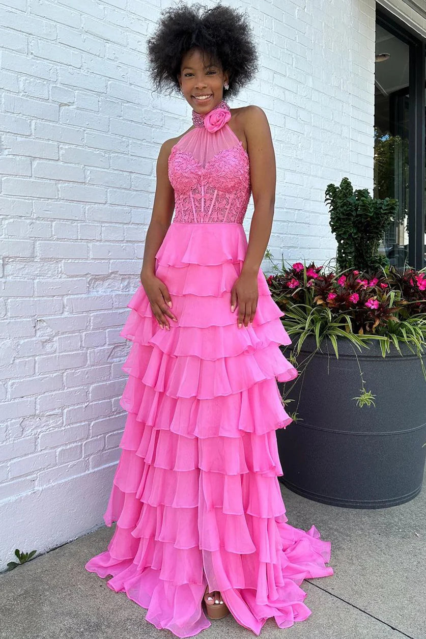 Elegant pink A-line prom dress with tiered chiffon skirt and lace halter neck top.