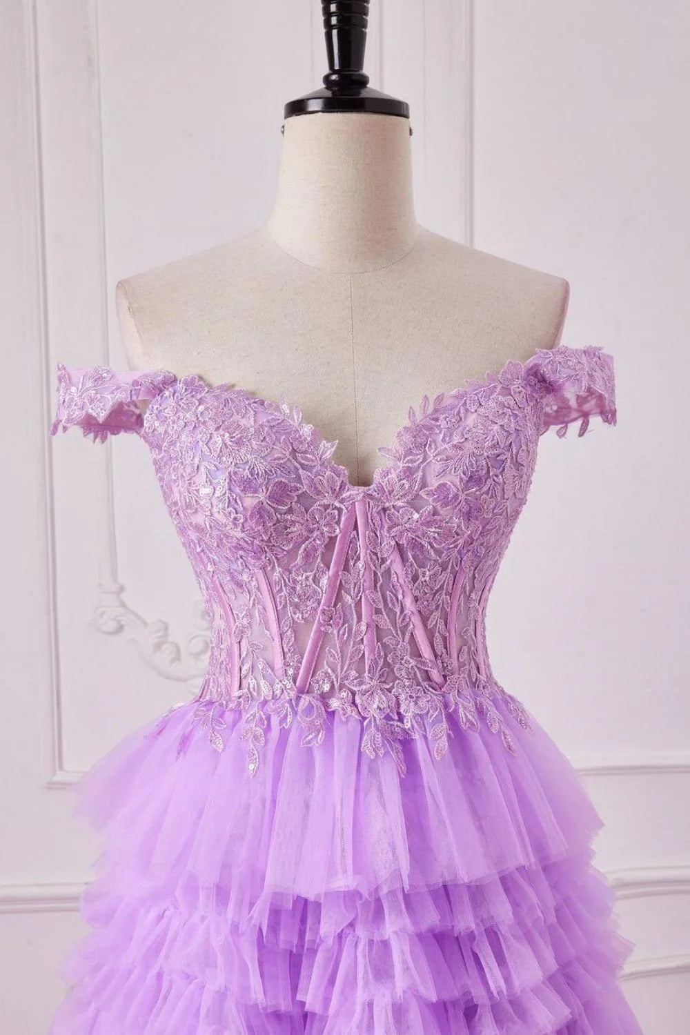 Full view of the purple A-line off-shoulder prom dress with intricate lace bodice.