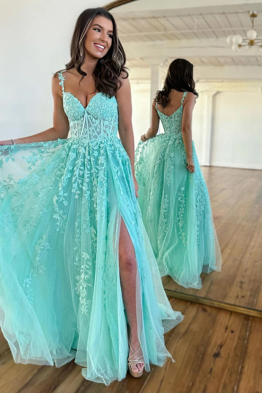 Elegant A-Line prom dress with spaghetti straps, beaded bodice, and tulle skirt with appliques.