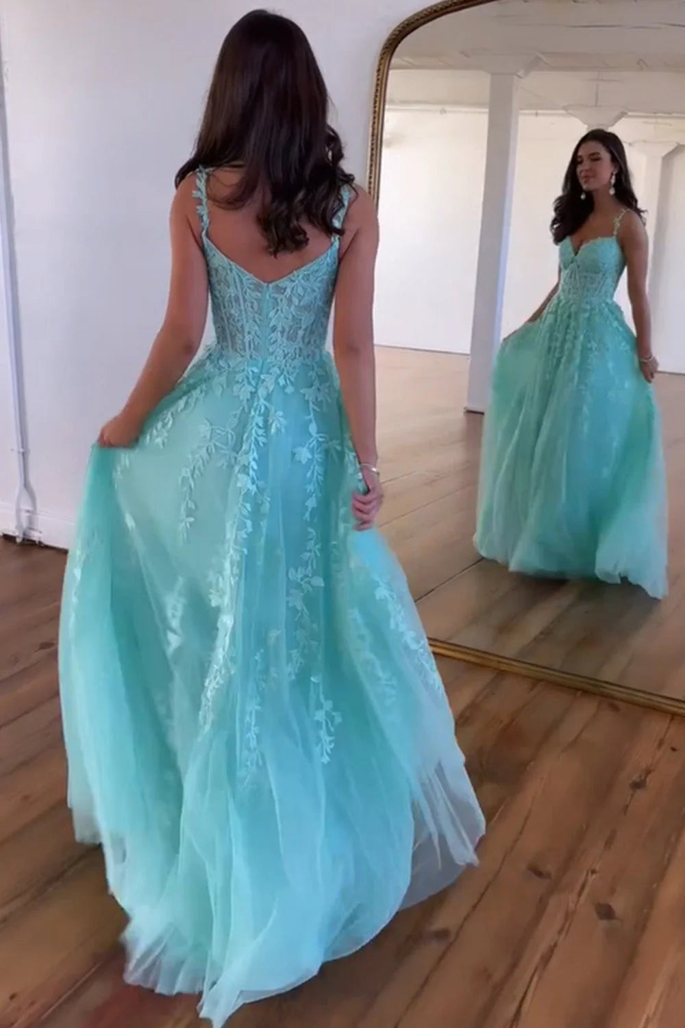 Full view of the A-Line beaded tulle prom dress, showcasing appliques and spaghetti straps.