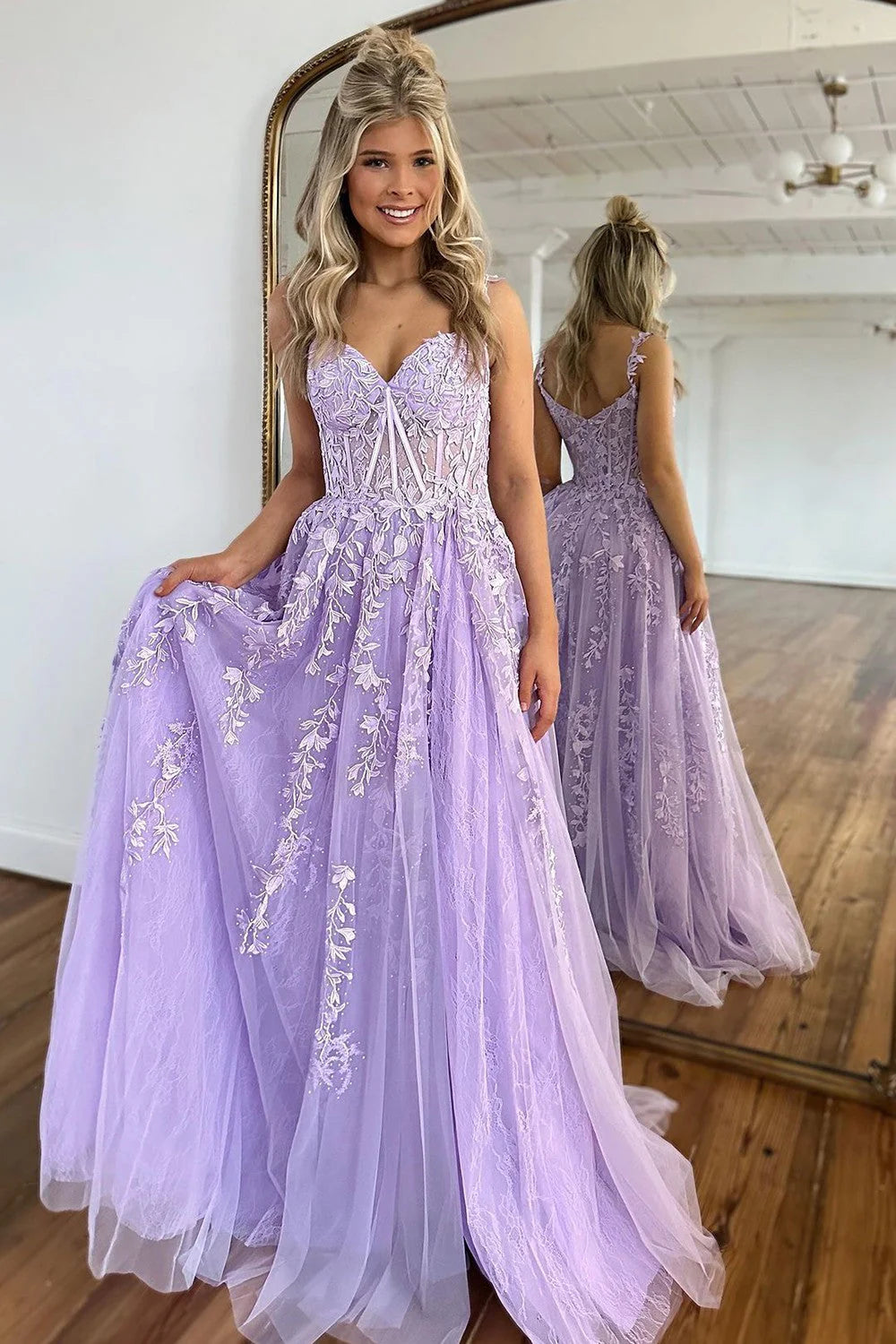 Front view of the romantic A-Line prom gown featuring delicate beading and tulle appliques.