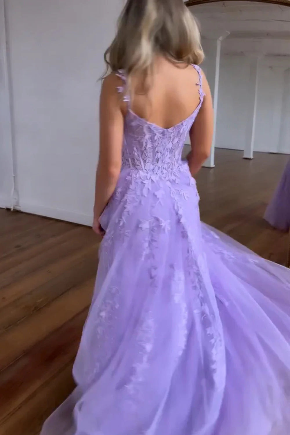 Side view of the A-Line spaghetti strap party dress, highlighting the floor-length tulle.
