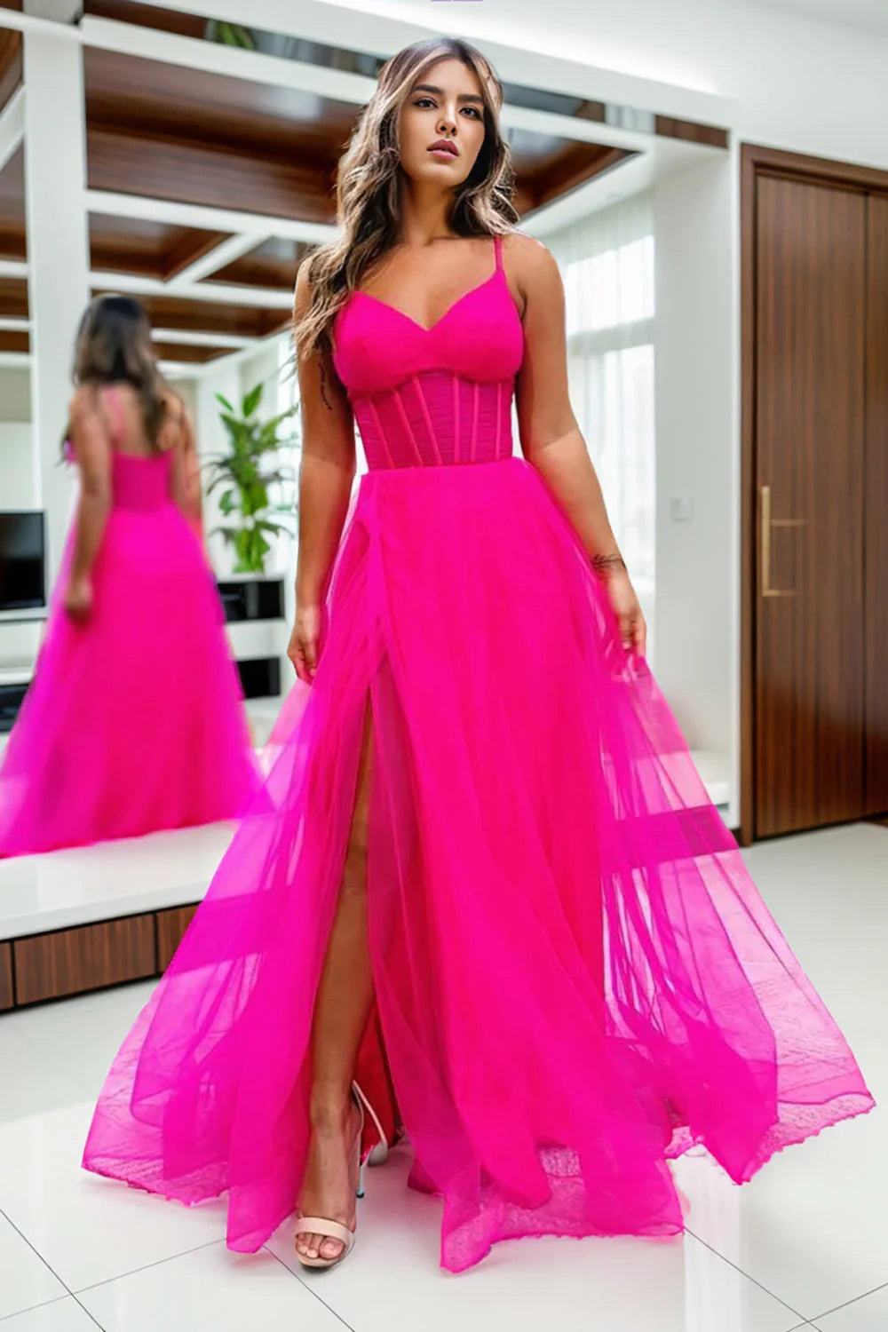 Hot pink A-line prom dress with spaghetti straps and a thigh-high slit.