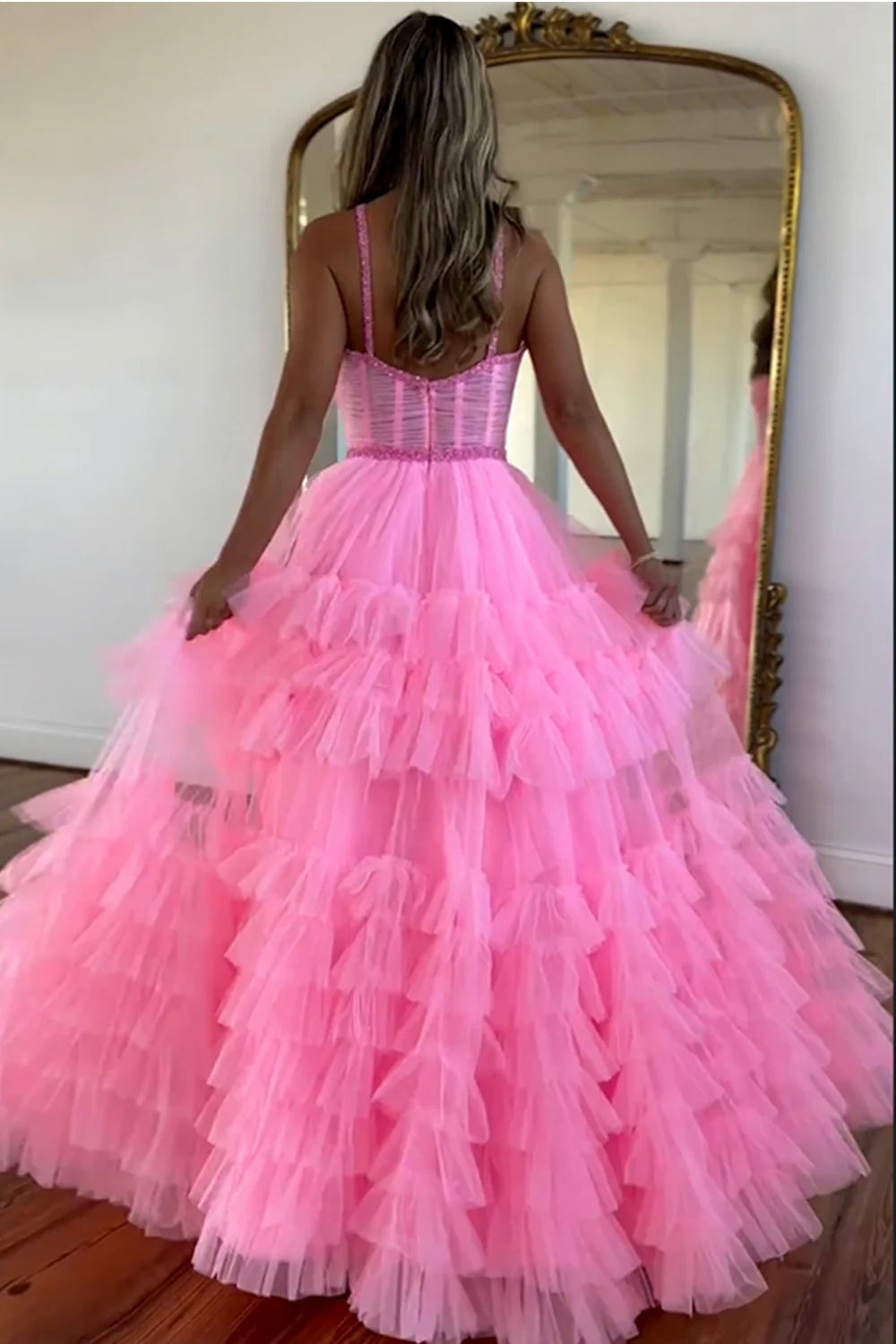 Front view of the pink A-Line prom dress, highlighting tiered tulle skirt and beaded bodice.