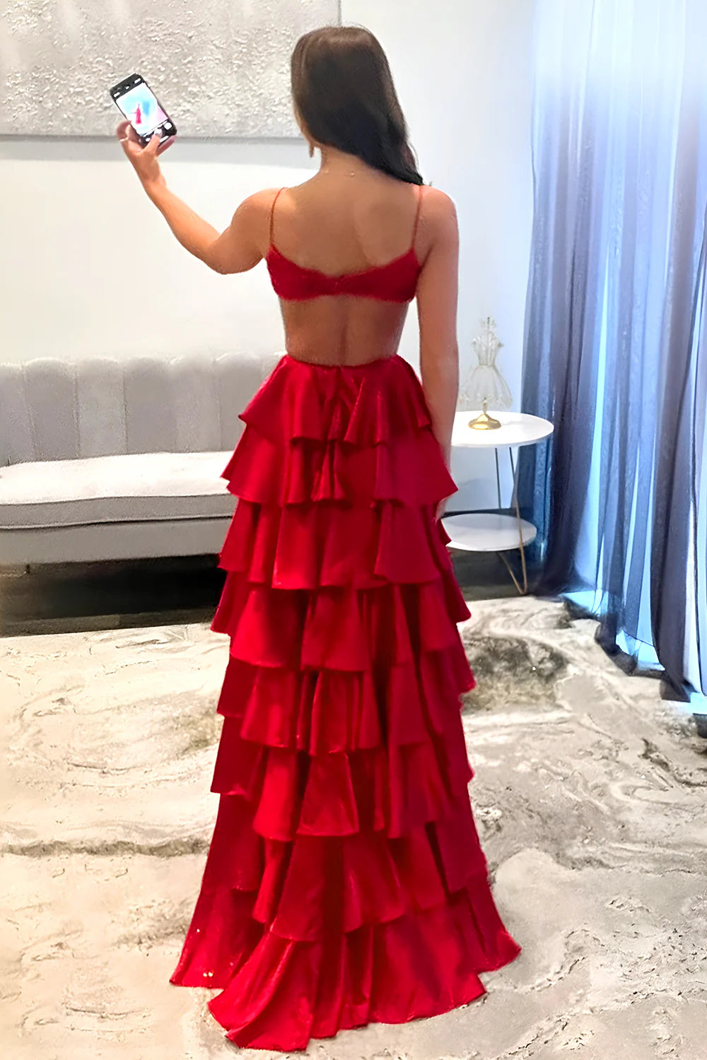 Back view of the red A-Line satin gown featuring an open back design.