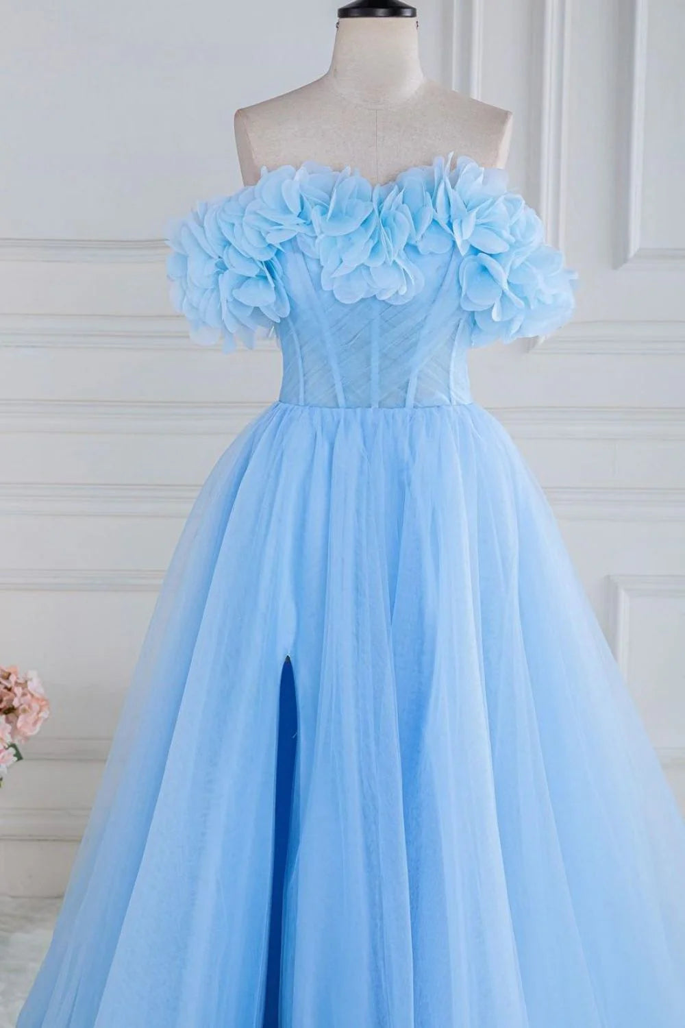 Side view of the blue A-line prom dress, showcasing the tulle skirt and thigh-high slit.