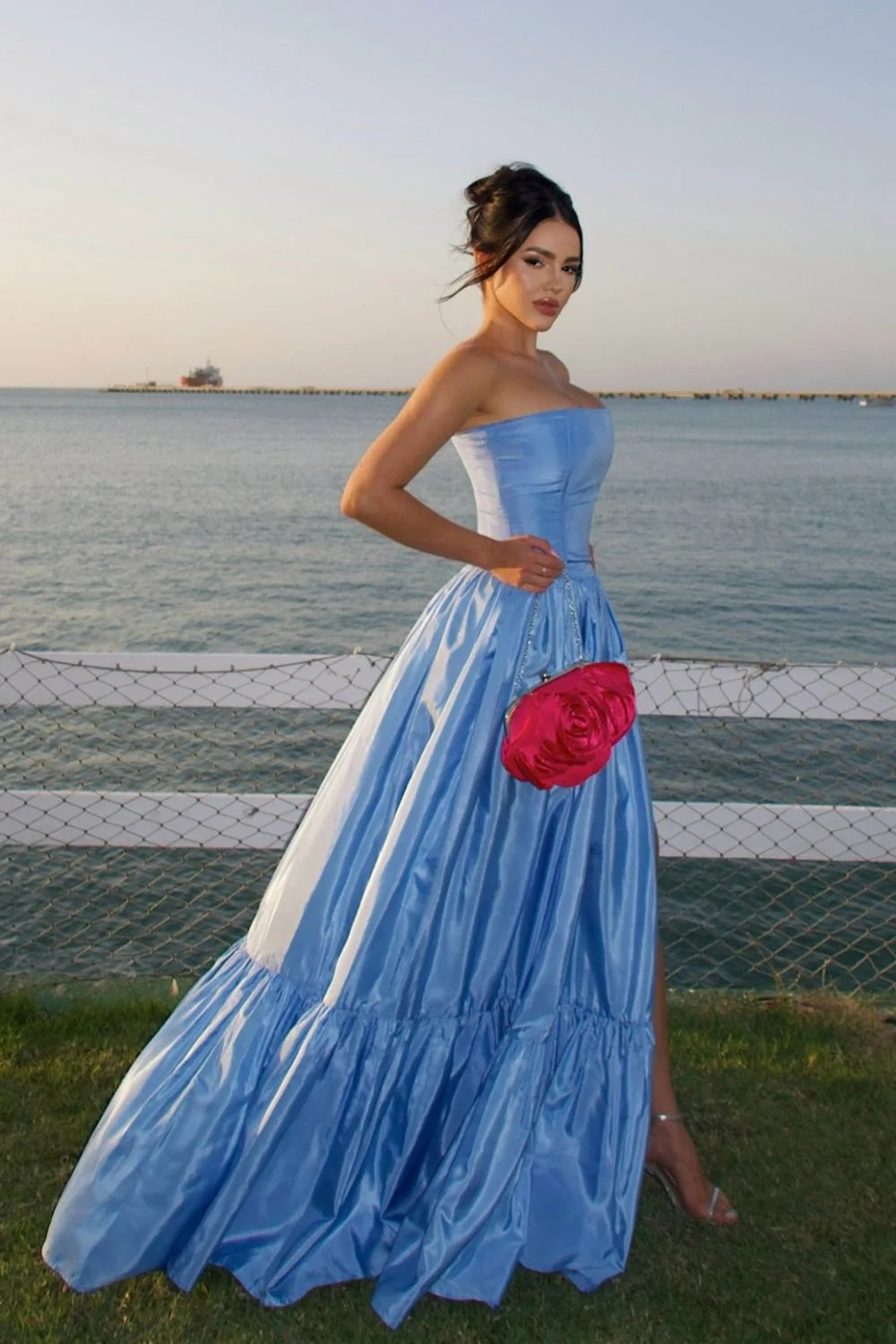Back view of the blue A-line strapless satin prom dress, showing the zipper closure.