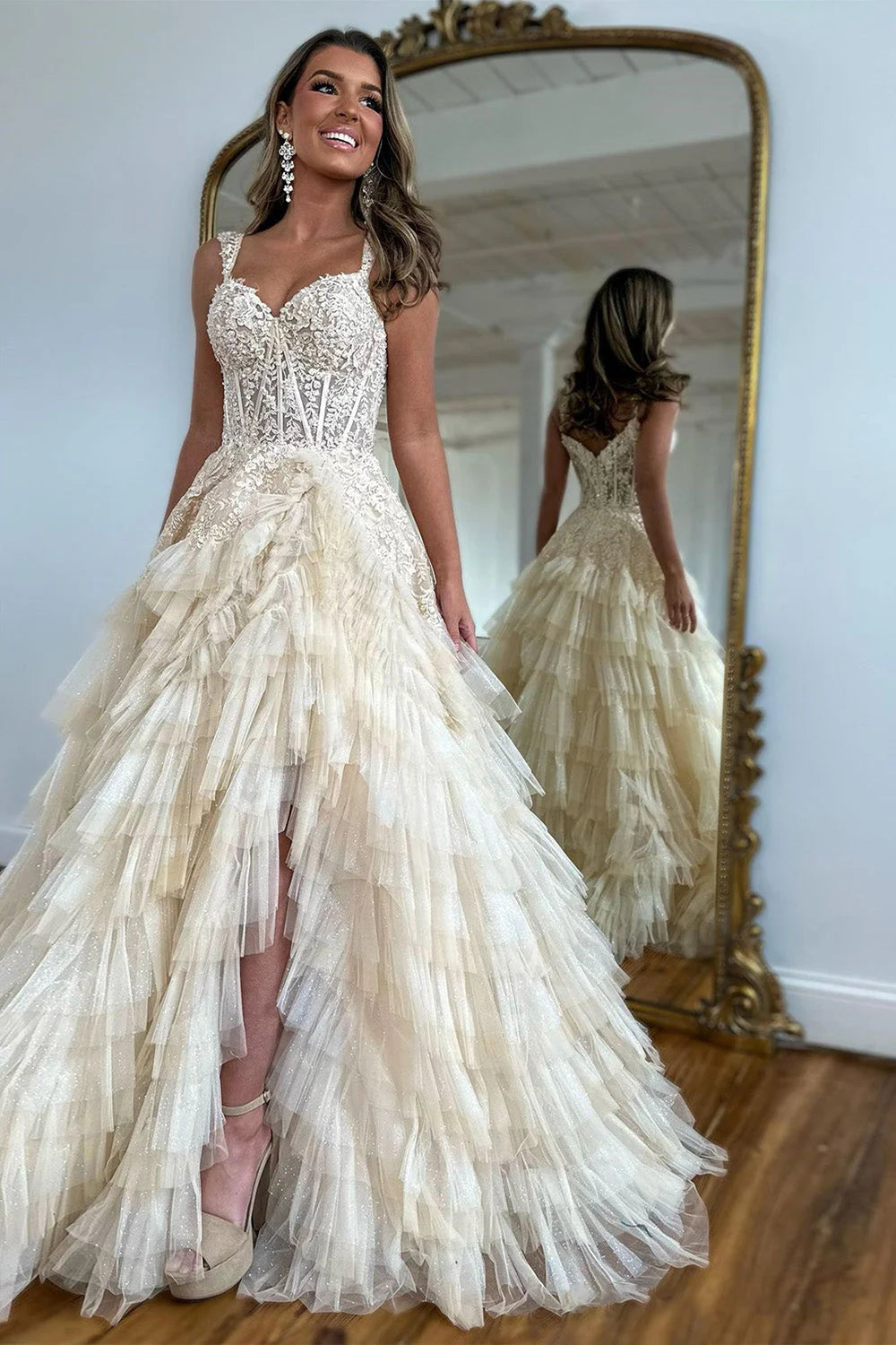 Champagne A-line prom dress with sweetheart neckline, tiered tulle, ruffles, and a high slit.