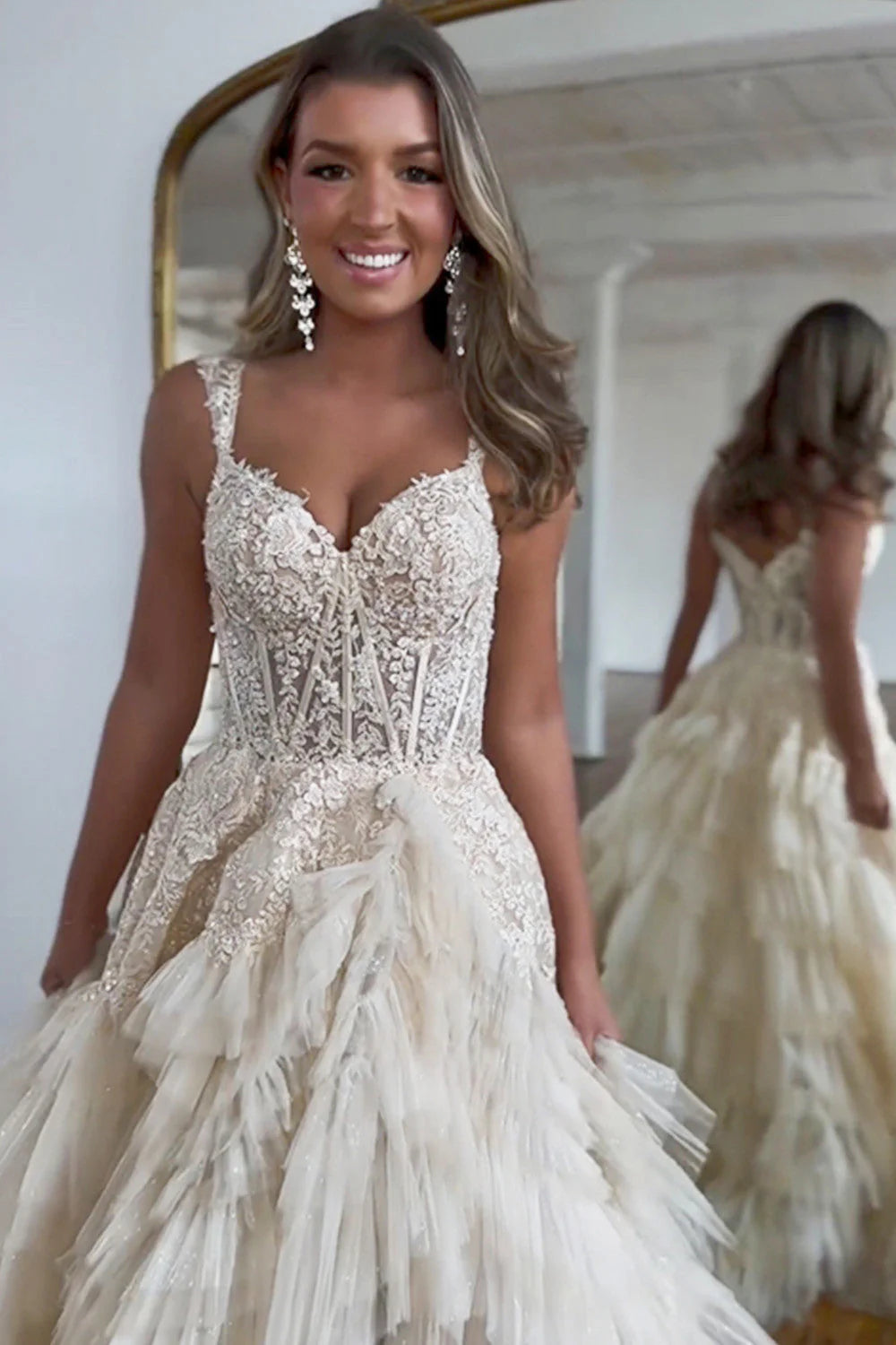 Close-up of the sweetheart neckline and beaded lace bodice on a champagne prom dress.
