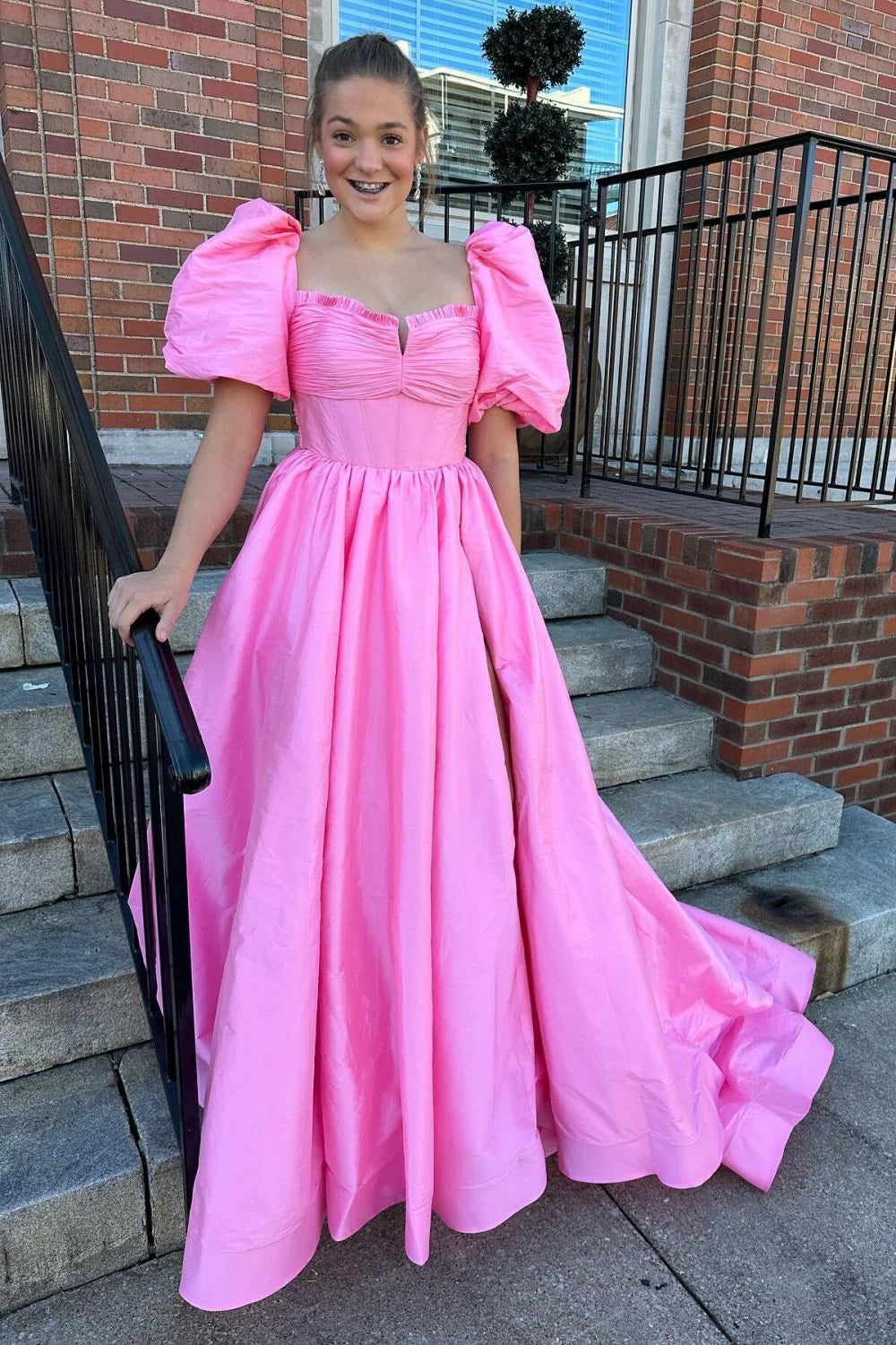 Elegant fuchsia A-line prom dress with sweetheart neckline and short sleeves.