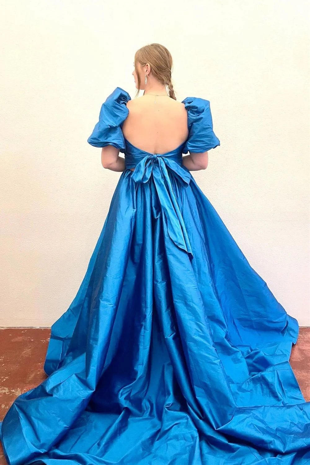 Fuchsia A-line gown with flowing skirt and elegant silhouette.