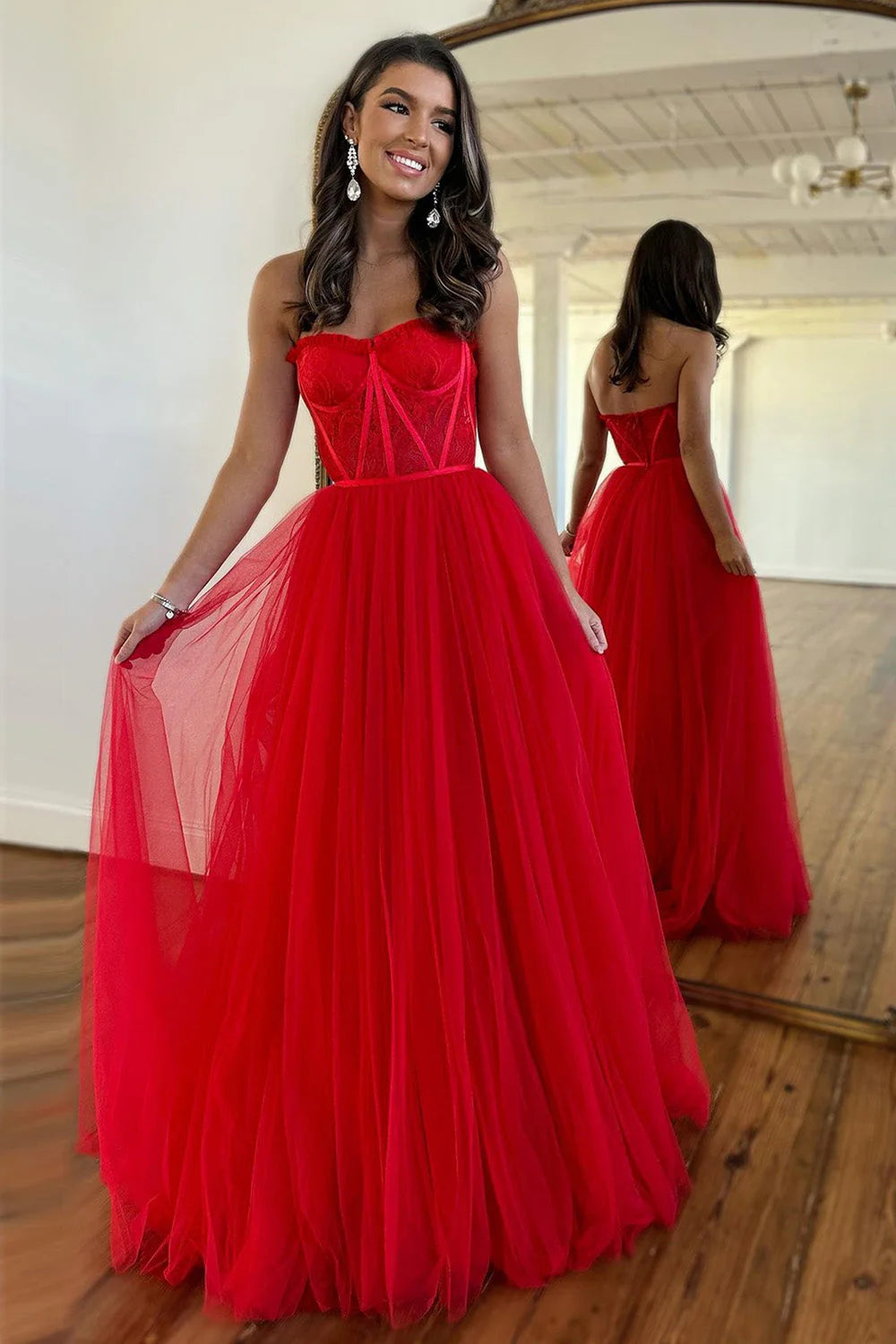 Full view of an elegant red A-line sweetheart tulle prom dress with a floor-length hem.