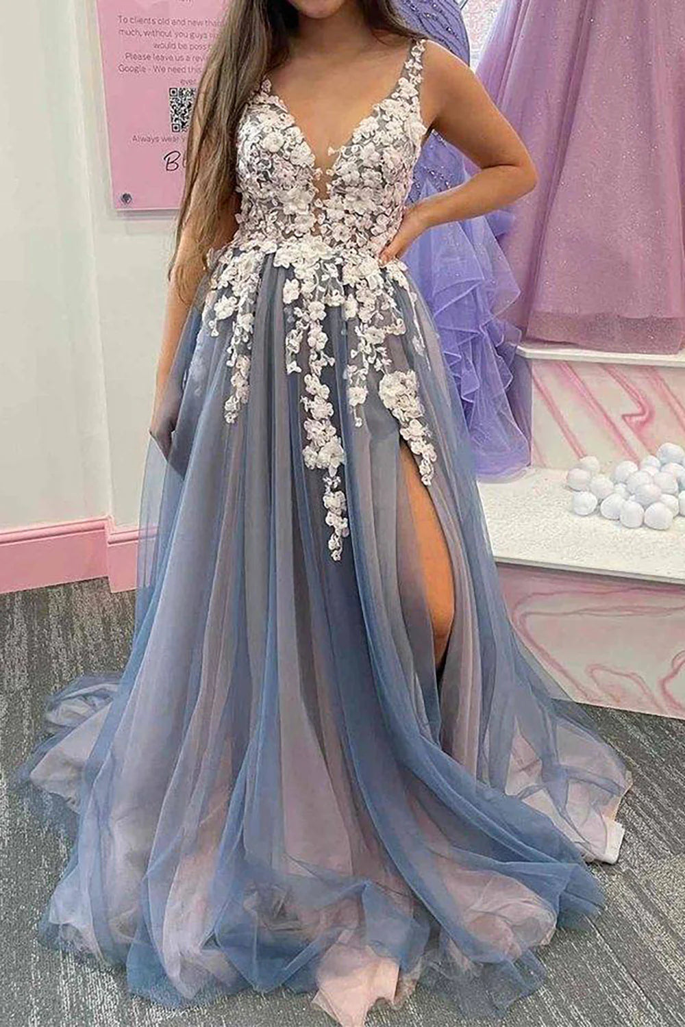 Elegant A-Line V-neck prom dress with appliques, keyhole back, and thigh-high split.