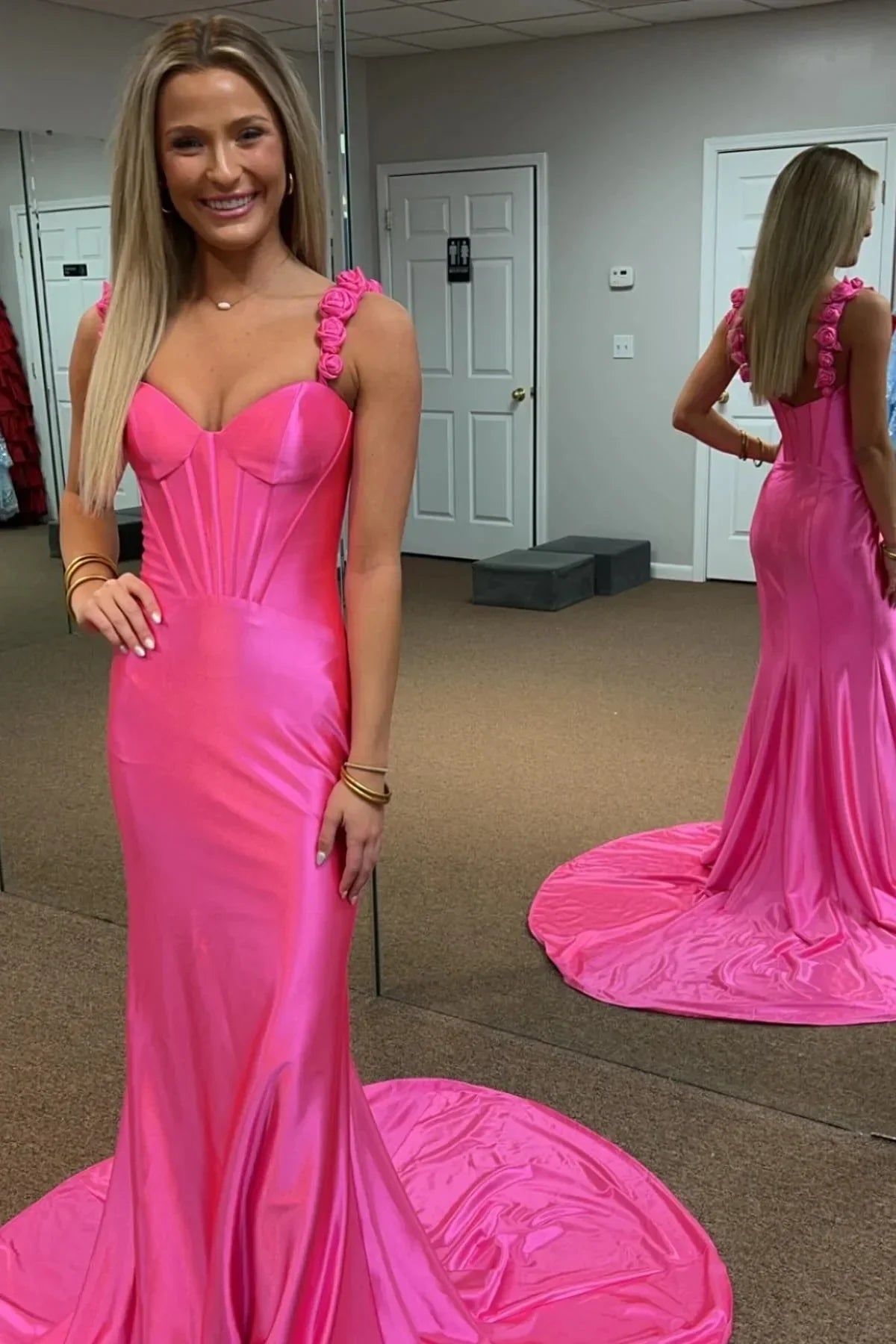 Stunning red mermaid prom dress with applique straps, open back, and high slit.