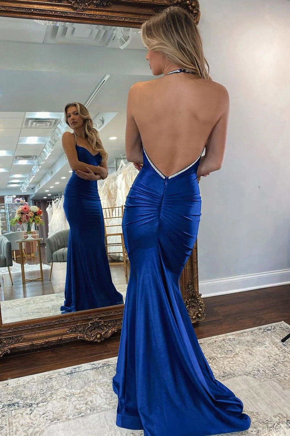Elegant royal blue satin mermaid gown with an open back design.