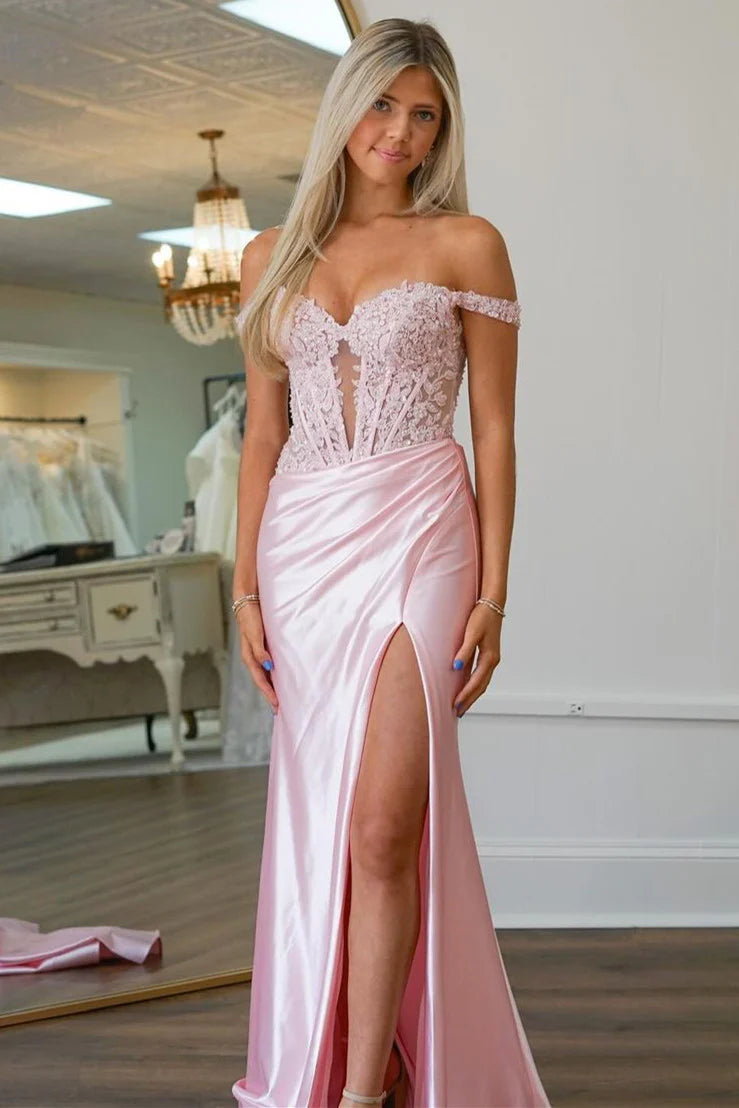 Model wearing an elegant pink mermaid off-shoulder prom dress with lace sequins and a high slit.