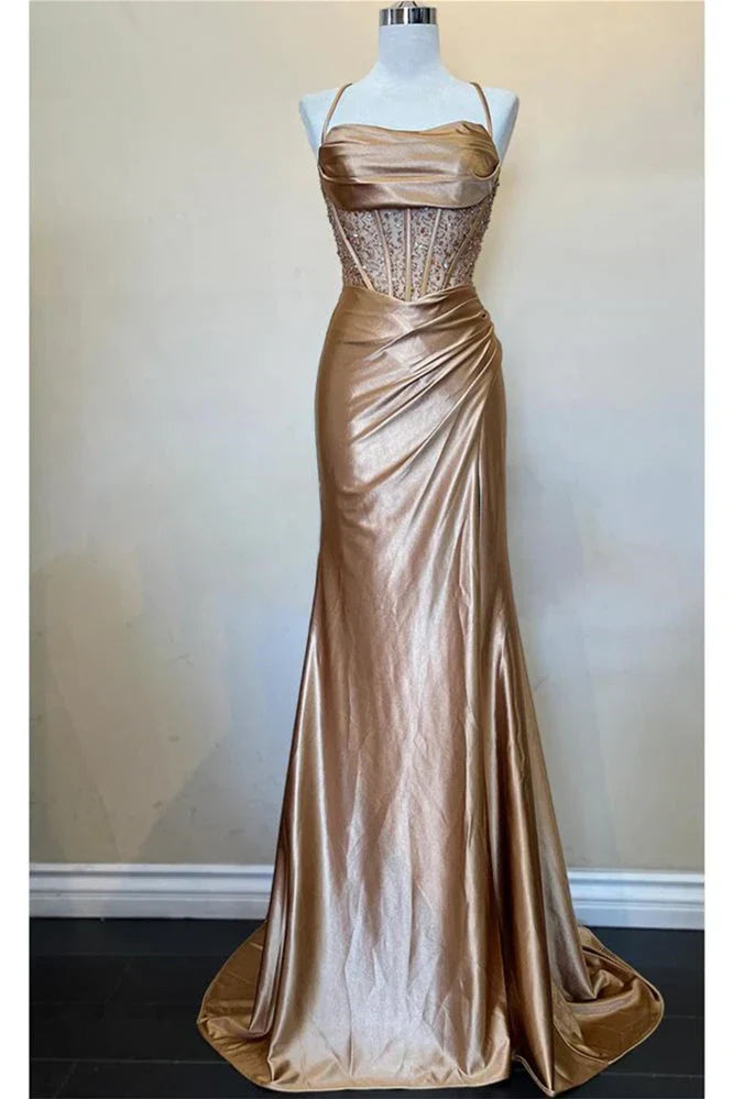 Front view of the green mermaid prom dress, displaying the spaghetti straps and mermaid silhouette.