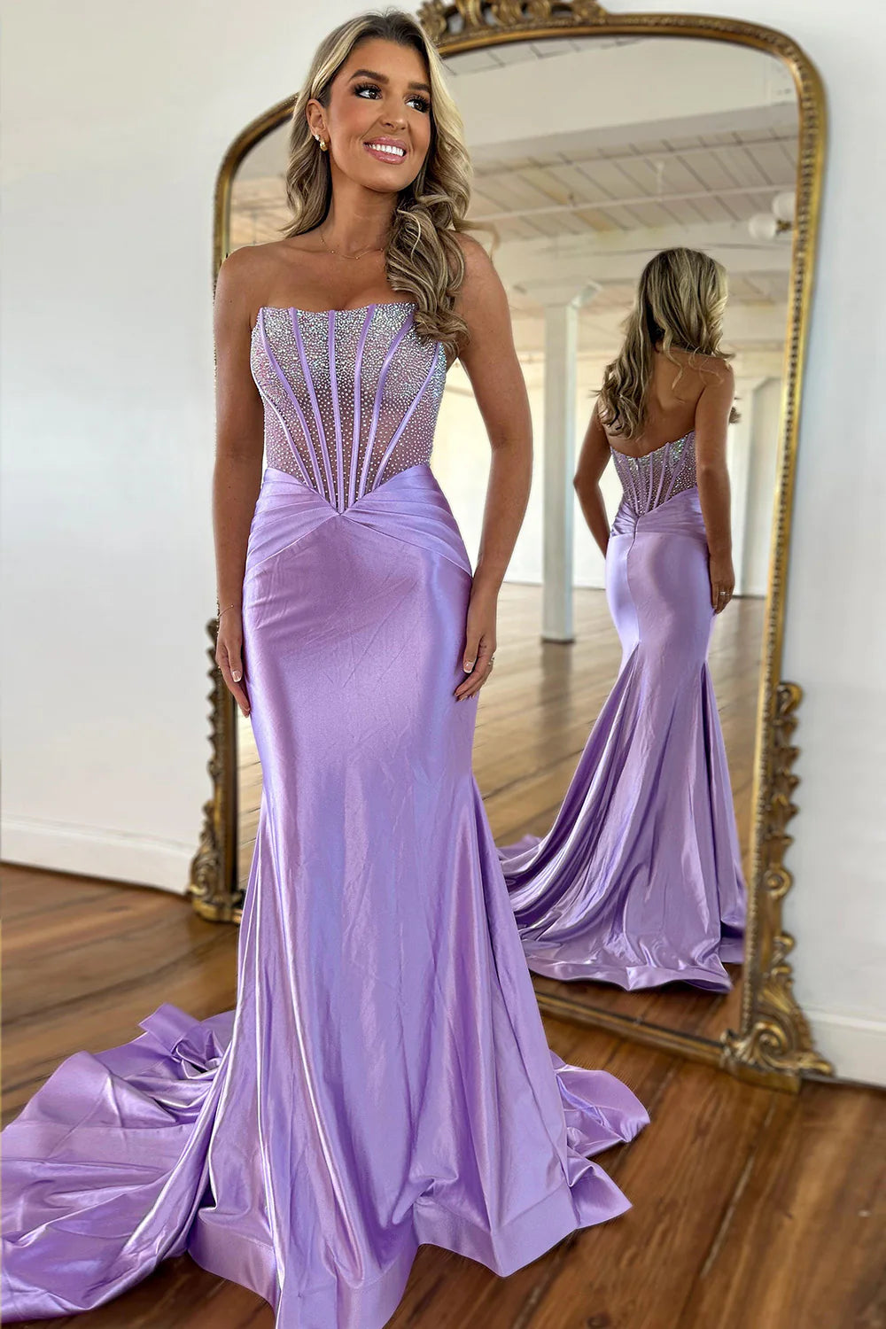 Elegant lilac mermaid prom dress with a strapless beaded satin top.
