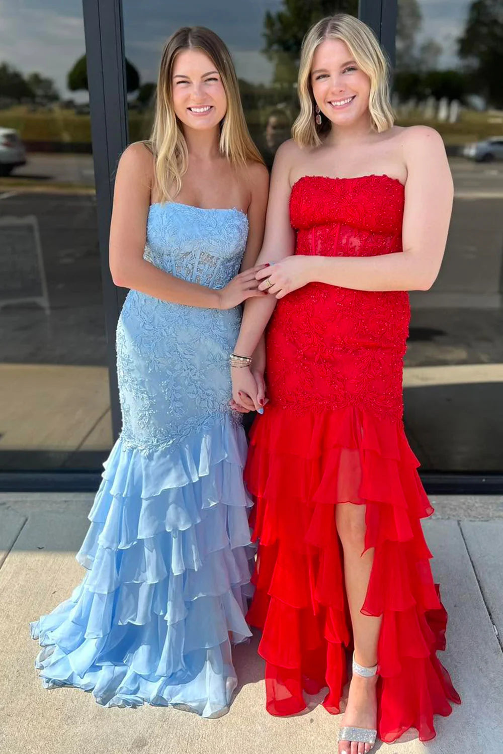 Elegant light blue mermaid prom dress with strapless lace top, beaded details, and tiered skirt.