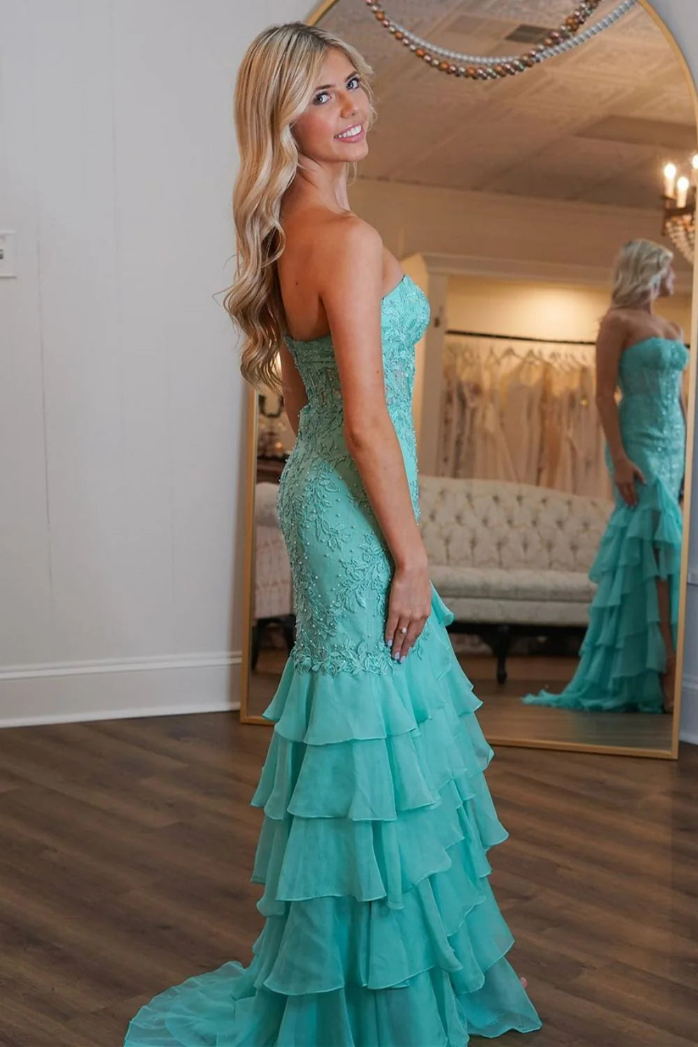 Back view of mint green mermaid prom dress showing zipper closure.