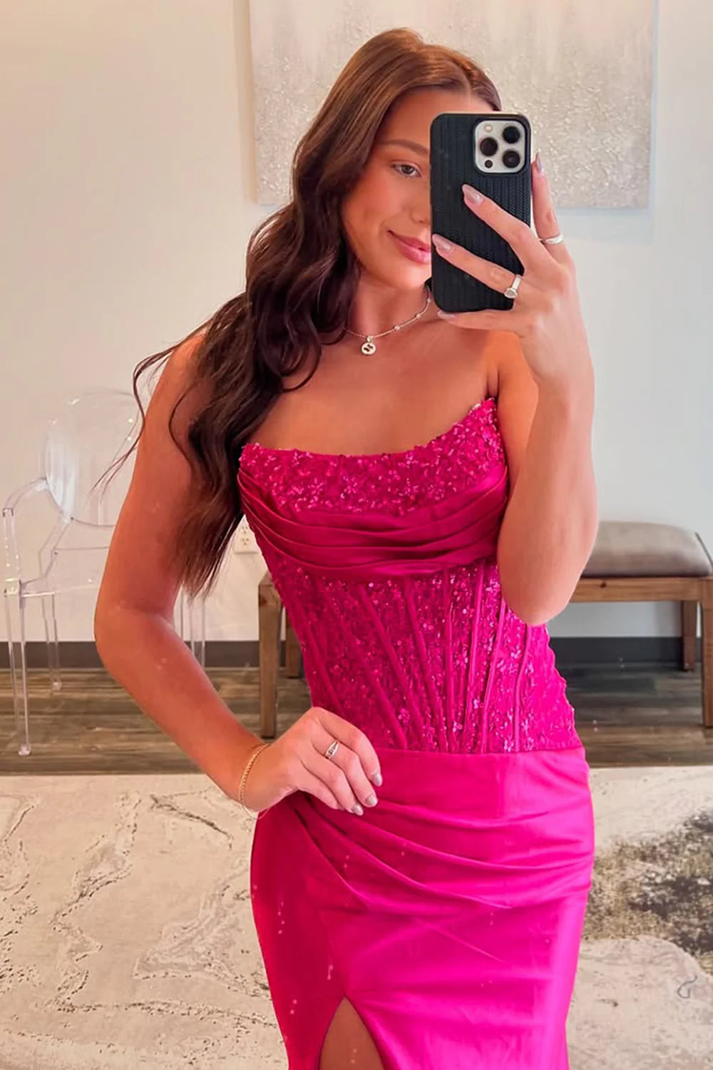 Back view of strapless fuchsia prom dress with invisible zip closure.