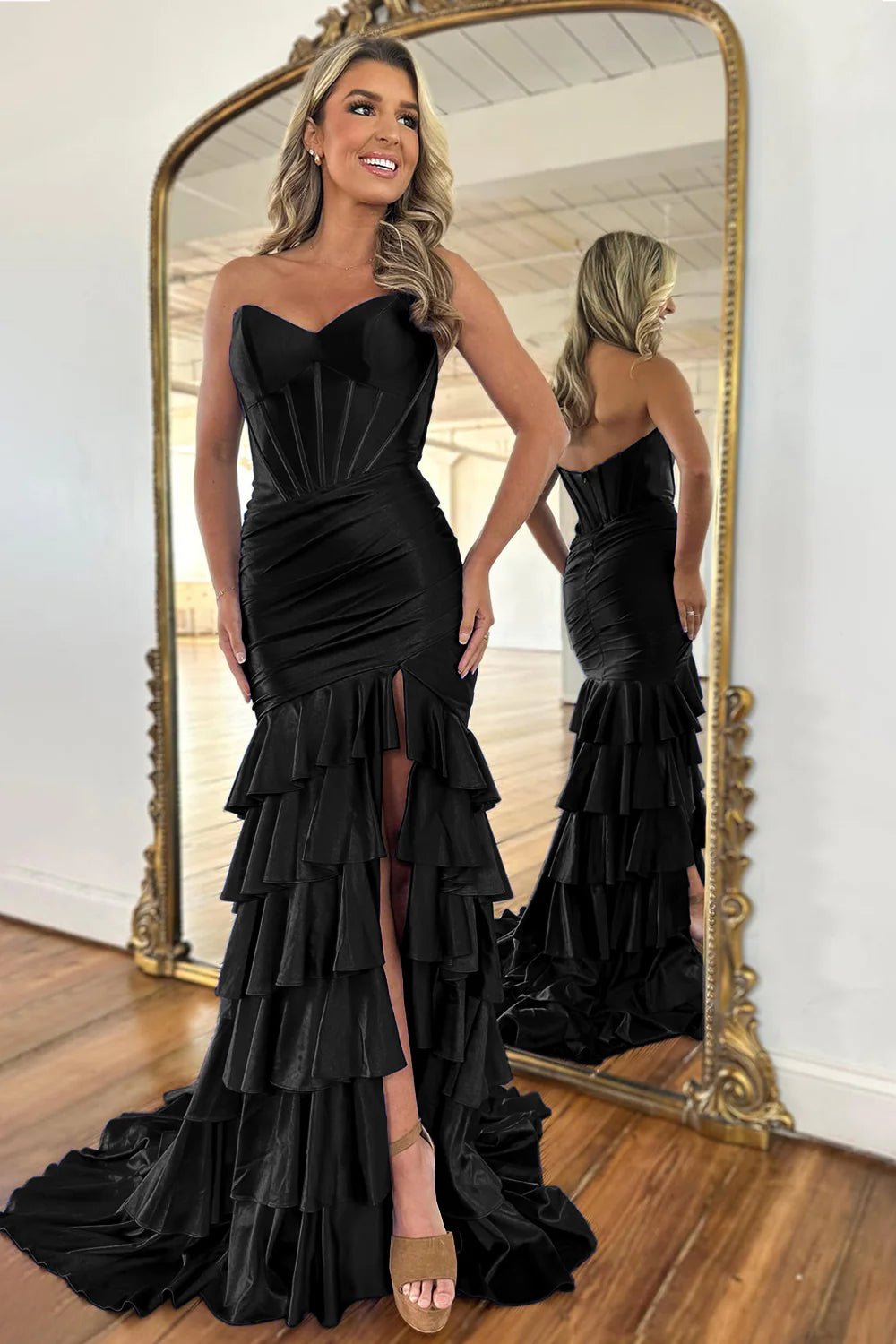 Close-up of the ruffle tiered skirt detail on a royal blue satin prom dress.