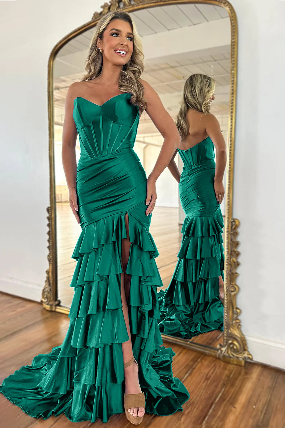Full-length front view of a royal blue strapless mermaid prom dress.