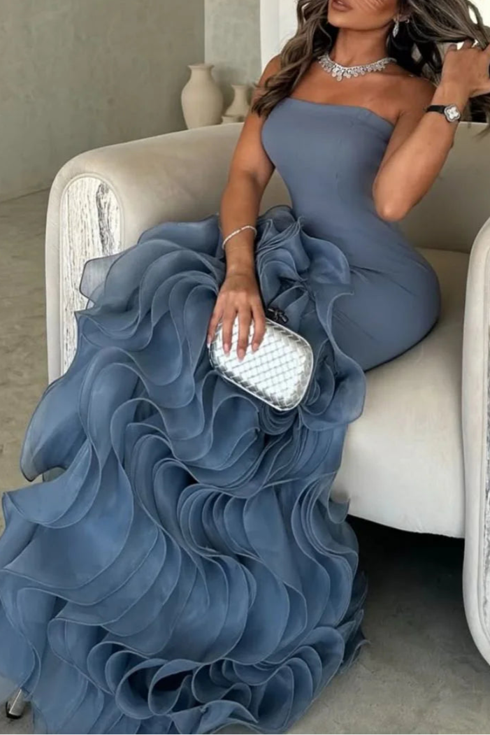 Close-up of the dusty blue strapless mermaid prom dress with ruffled tulle details.