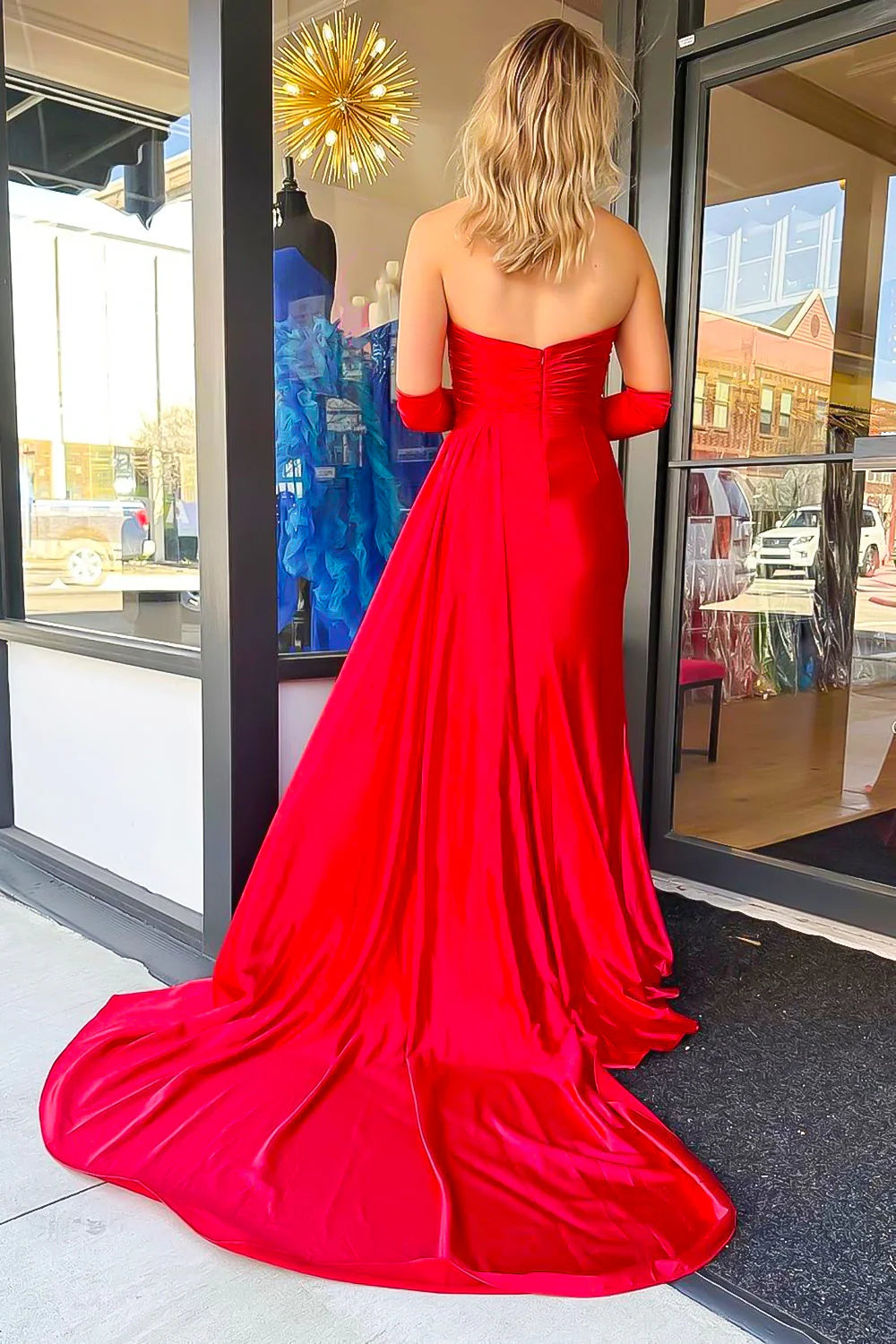 Close-up of the sweetheart neckline with delicate appliques on the black prom dress.