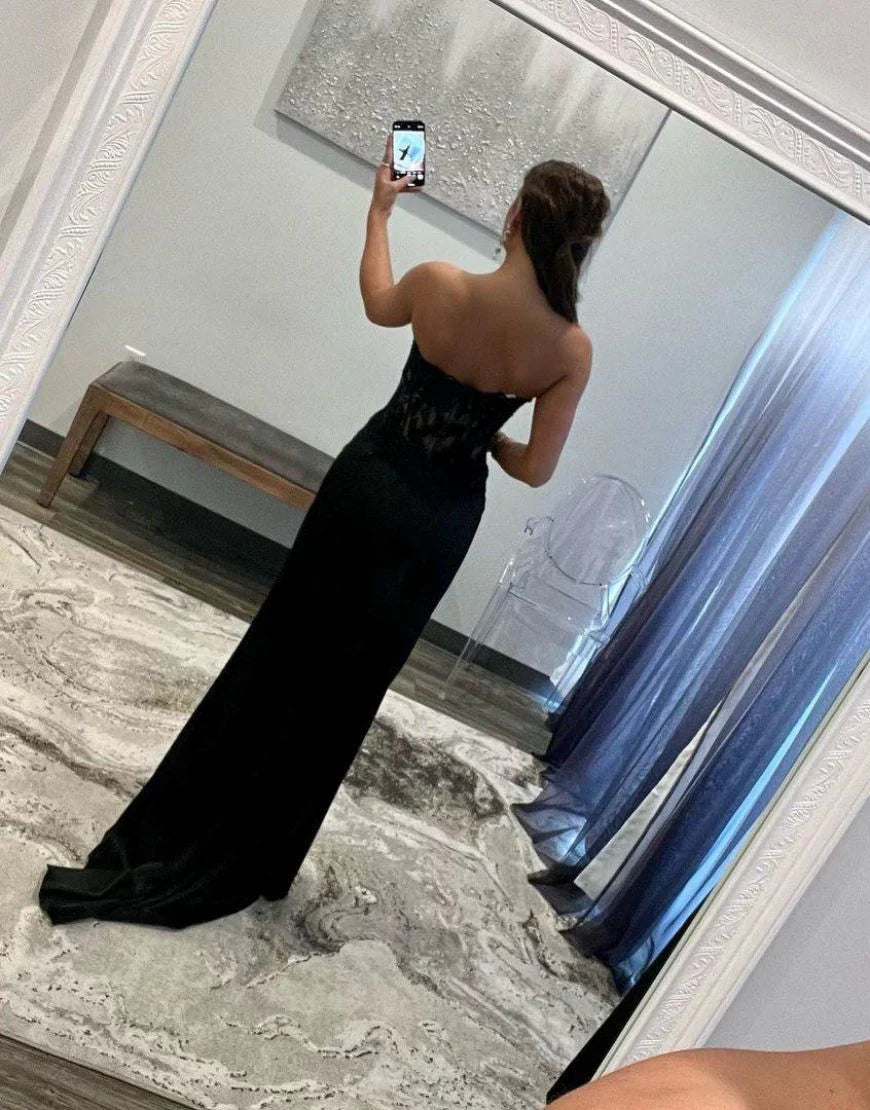 Back view of a black mermaid prom dress, showcasing the zipper.