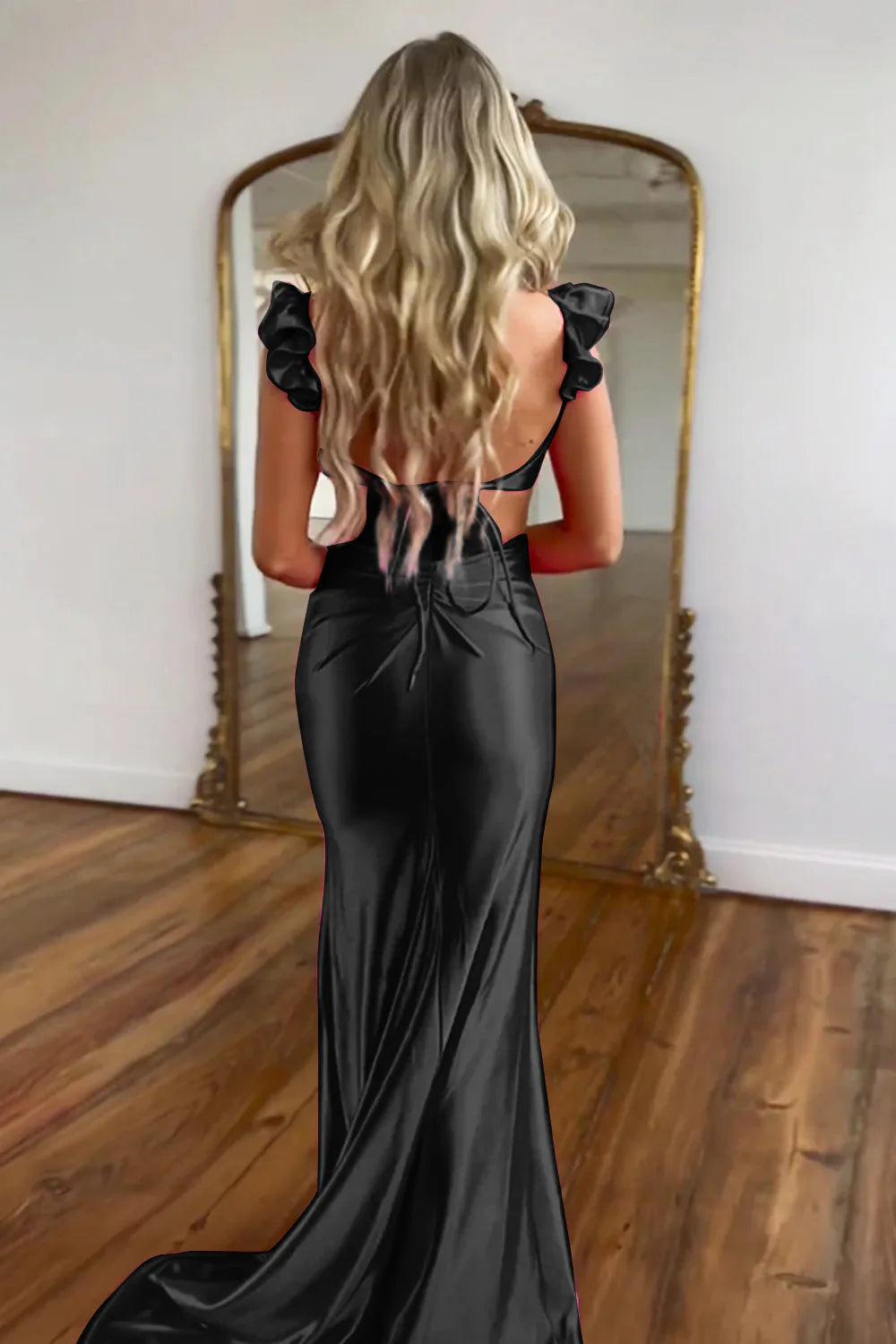 Full length view of a model posing in the elegant hot pink mermaid gown.
