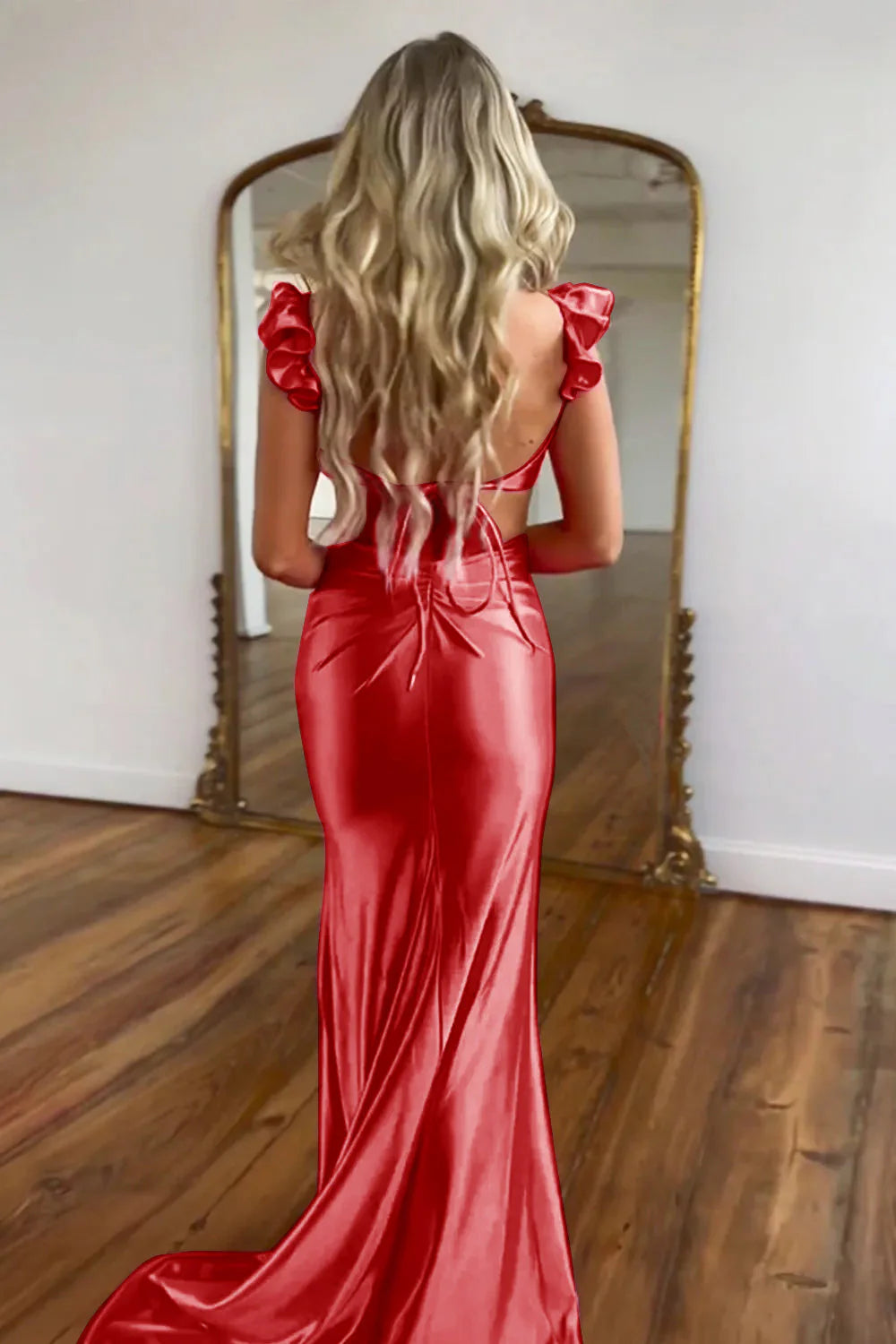 Detail of the cutout waist and luxurious satin fabric on the hot pink dress.