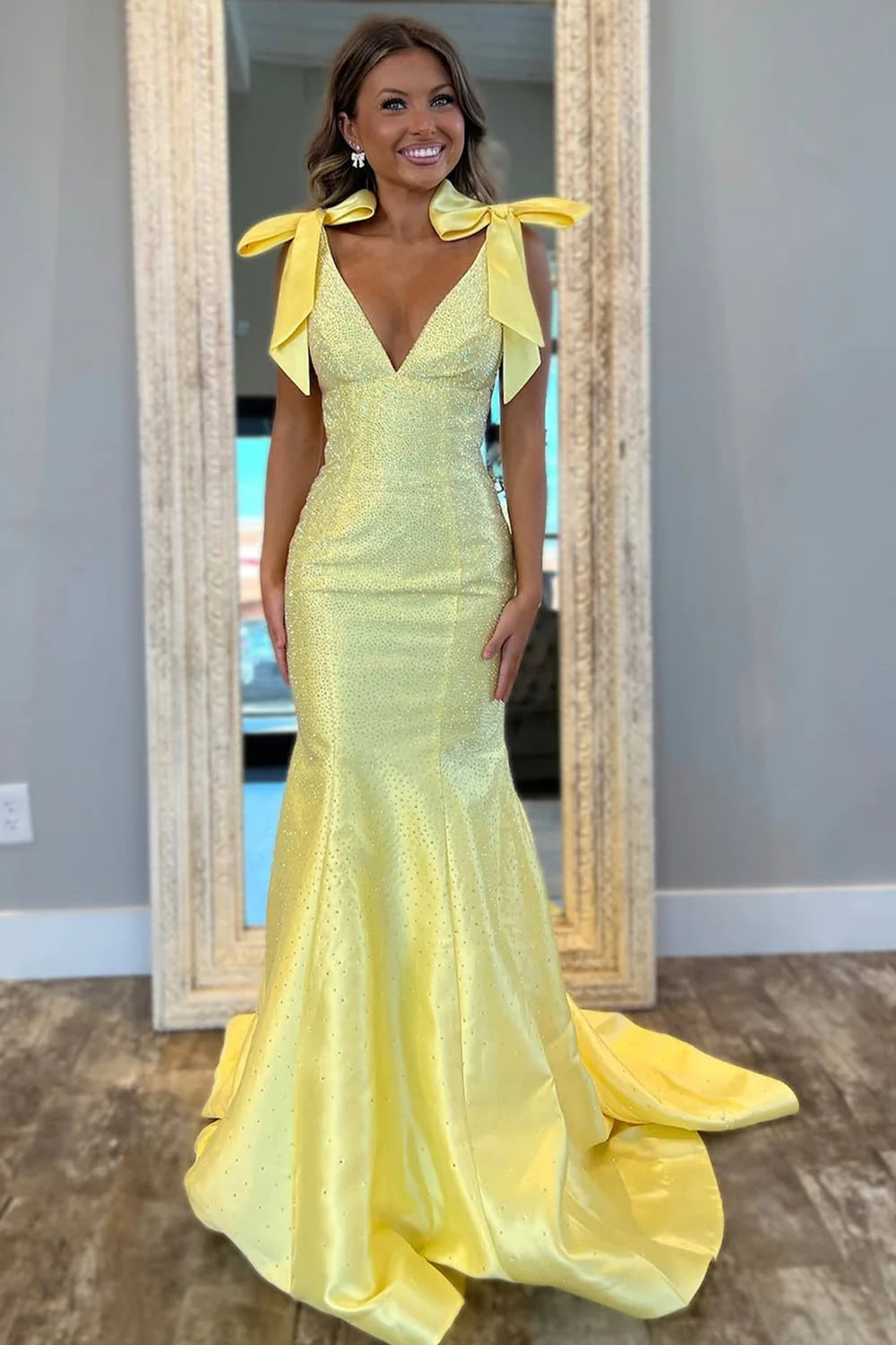 Back view of the yellow mermaid prom dress, showcasing the elegant V-back design.