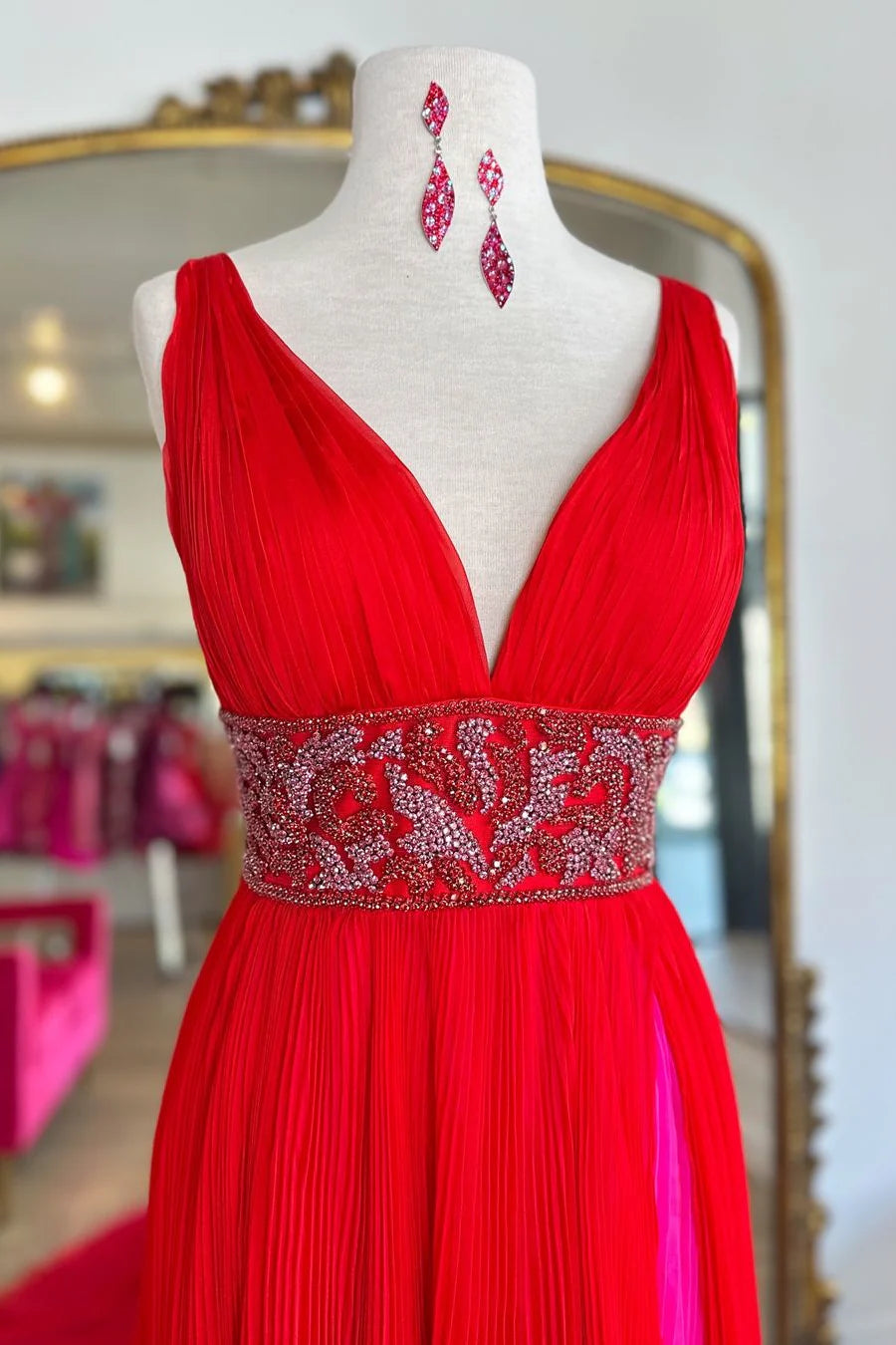 Full view of the red A-Line prom dress with a chic front slit.