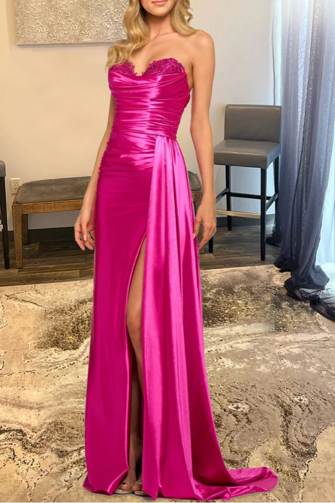 Model wearing a glamorous hot pink A-line prom dress with a sweetheart neckline, thigh-high split, and glitter satin fabric.