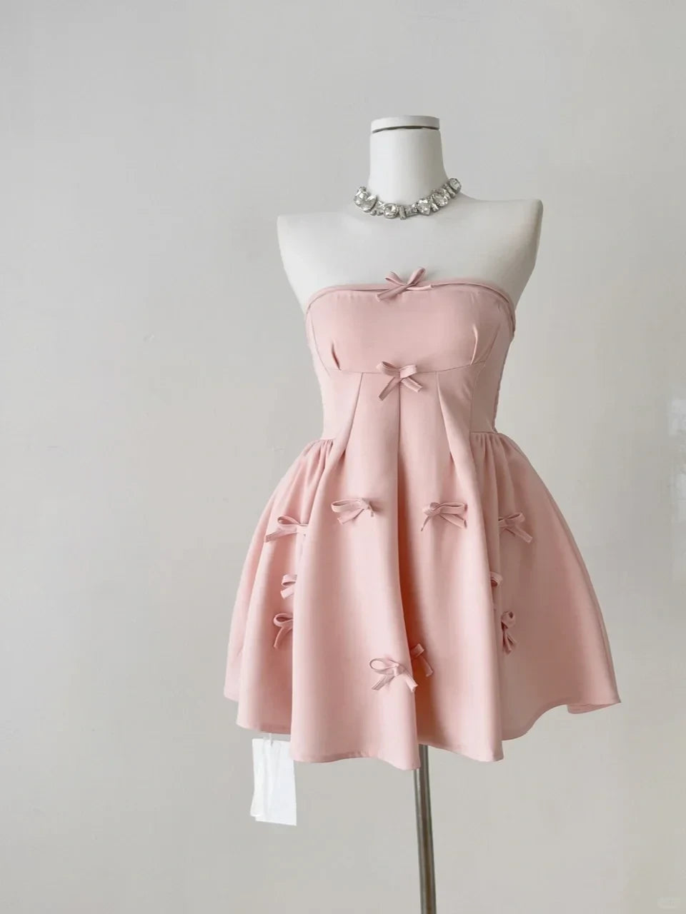 Lovely A-Line Strapless Smocked Satin Pink Short Homecoming Dress With Bow