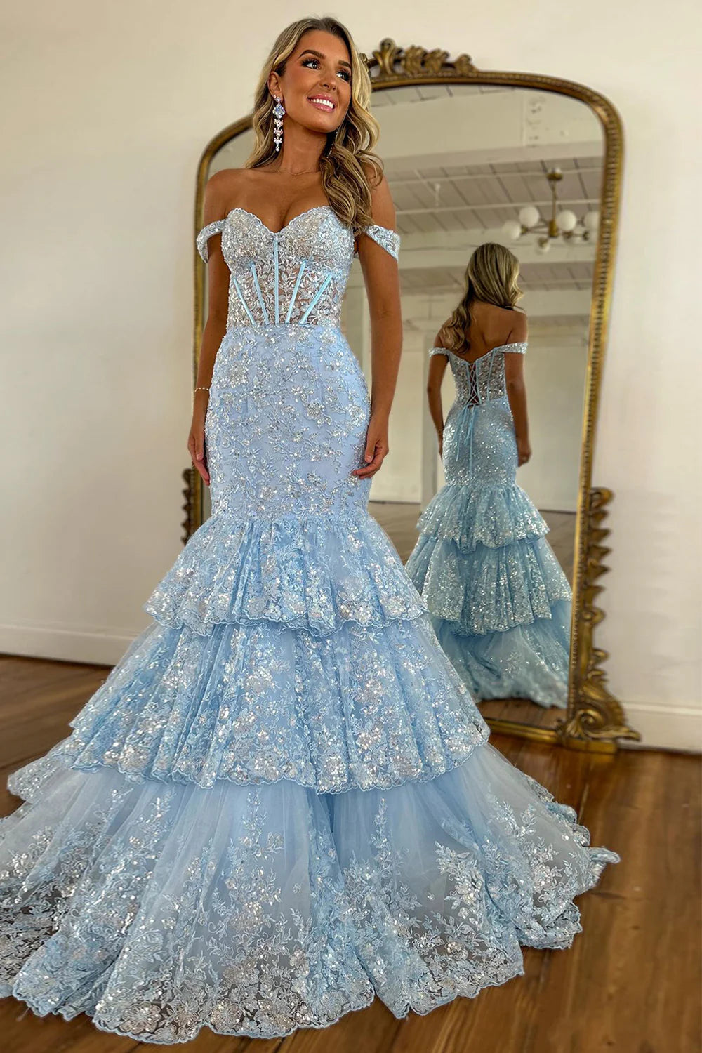 Sparkly light blue mermaid prom dress with off-the-shoulder neckline and intricate appliques.