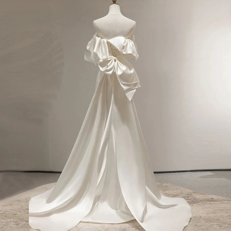 Stylish A-Line Off-Shoulder Ruffled Bow-Back Satin Ivory Floor Length Wedding Dress