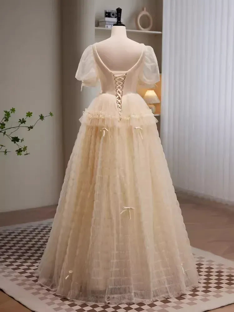 Whimsical A-Line Sweetheart Neck Puff Sleeve Bow Champagne Long Prom Dress For Women Custom